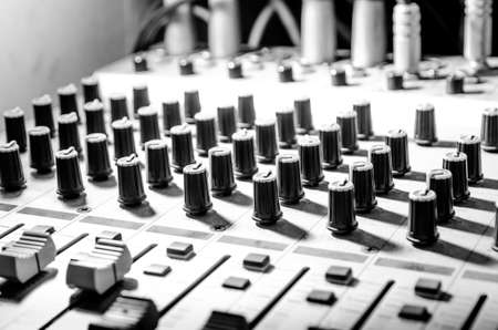 sound studio adjusting record equipment