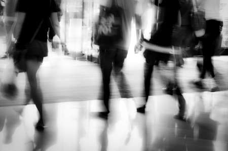 business people activity standing and walking in the lobby motion blurred abstract backgroundの写真素材