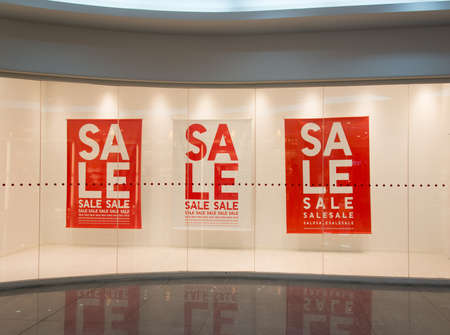 Sale sign text on wall in marketplace