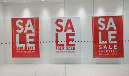Sale sign text on wall in marketplaceの写真素材