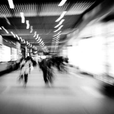 business people walk at subway station abstract blurの写真素材