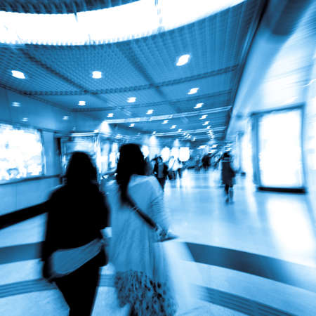 business people walk at subway station abstract blurの写真素材