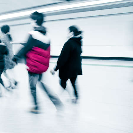 business people walk at subway station abstract blurの写真素材