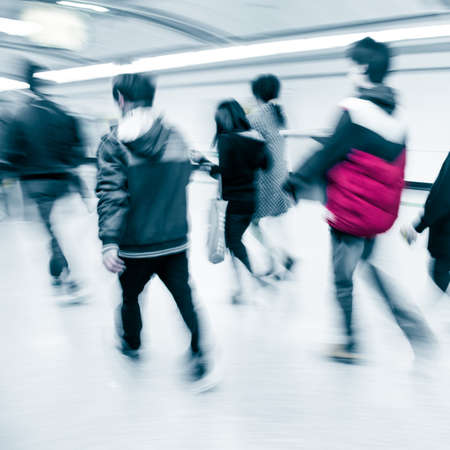 business people walk at subway station abstract blurの写真素材