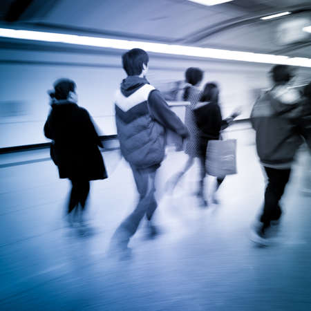 business people walk at subway station abstract blurの写真素材
