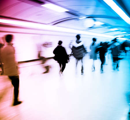 business people walk at subway station abstract blurの写真素材