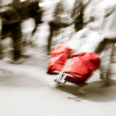 walking passenger with traveling case blur motionの写真素材
