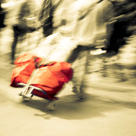 walking passenger with traveling case blur motionの写真素材