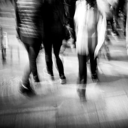 Commuters crossing at rush hour, blur motionの写真素材