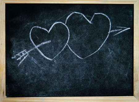 love concept, two heard on blackboardの写真素材