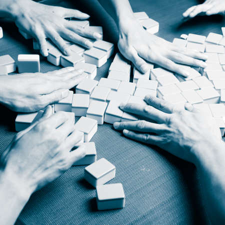 people playing mahjong gameの写真素材