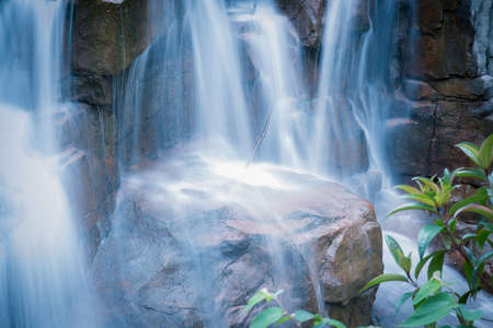 beautiful zen garden waterfall in slow shutterの写真素材