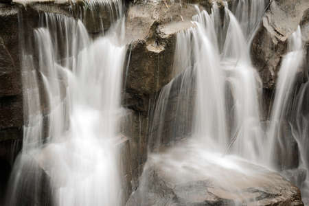 beautiful zen garden waterfall in slow shutterの写真素材