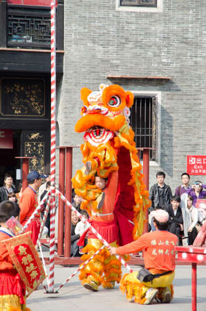 Foshan,China- Feb. 19: Chinese Lion dance perform on Feb. 19, 2012 in Foshan, China. lion dance can be often seen in festive celebrations.のeditorial素材