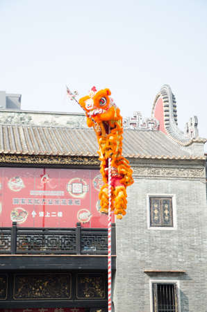 Foshan,China- Feb. 19: Chinese Lion dance perform on Feb. 19, 2012 in Foshan, China. lion dance can be often seen in festive celebrations.のeditorial素材