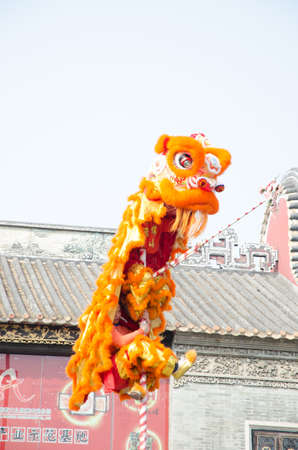Foshan,China- Feb. 19: Chinese Lion dance perform on Feb. 19, 2012 in Foshan, China. lion dance can be often seen in festive celebrations.のeditorial素材