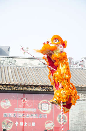 Foshan,China- Feb. 19: Chinese Lion dance perform on Feb. 19, 2012 in Foshan, China. lion dance can be often seen in festive celebrations.のeditorial素材