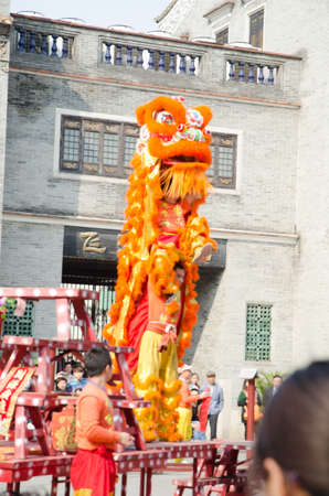 Foshan,China- Feb. 19: Chinese Lion dance perform on Feb. 19, 2012 in Foshan, China. lion dance can be often seen in festive celebrations.のeditorial素材
