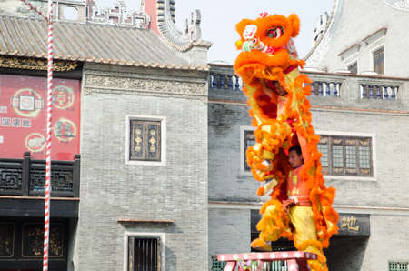 Foshan,China- Feb. 19: Chinese Lion dance perform on Feb. 19, 2012 in Foshan, China. lion dance can be often seen in festive celebrations.のeditorial素材