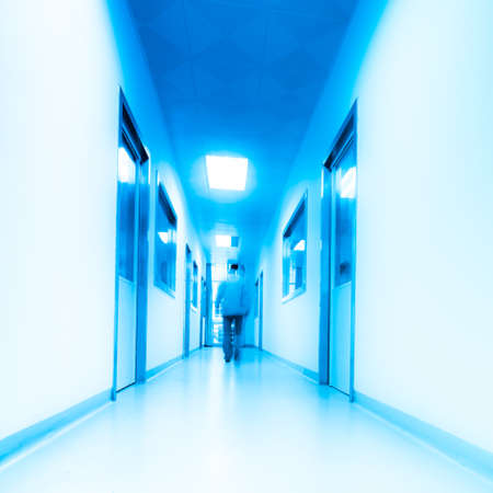 people walking in modern laboratory, blur motion.の写真素材