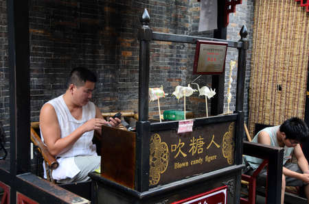 CHENGDU, CHINA-SEP 08: Shopper and stores at Jinli retro Pedestrian Street on SEP 08, 2011 in CHENGDU, China. Jinli Street is one of the most famous street of China where full of retro Chinese elementのeditorial素材