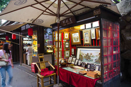 CHENGDU, CHINA-SEP 08: Shopper and stores at Jinli retro Pedestrian Street on SEP 08, 2011 in CHENGDU, China. Jinli Street is one of the most famous street of China where full of retro Chinese elementのeditorial素材