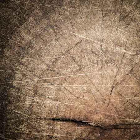 shabby cut tree trunk scored surface texture backgroundの写真素材