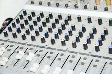 sound studio adjusting record equipment