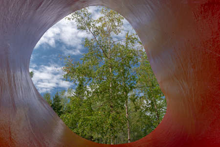 Metis-sur-Mer, Quebec, Canada - August 23, 2018:  View of a tree through a sculpture, Reford gardens, Metis-sur-mer, Quebecのeditorial素材