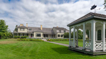 Metis-sur-Mer, Quebec, Canada - August 23, 2018:  Back garden gazebo of a victorian architecture summer lodge at Reford Gardens taken during an overcast summer day, Metis-sur-mer, Quebecのeditorial素材