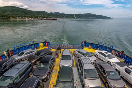 A full ferry boat crossing the St. Lawrence River to Aux Coudres Island, Province of Quebec, Canadaの写真素材