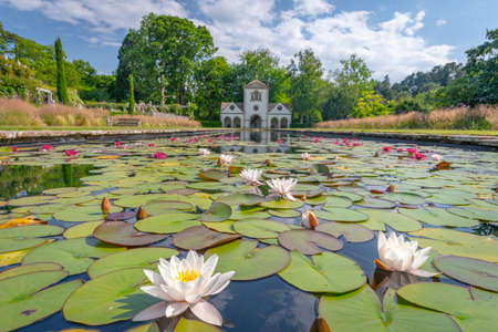 Bodnant Garden, Conwy, Wales, United Kingdom - July 19, 2018: Pin Mill reflecting on a pond adorned with water lilies, Bodnant garden, Conwy, Walesのeditorial素材