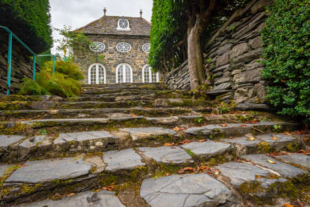 Plas Brondanew, Gwynedd, North Wales, United Kingdom - July 21, 2018: Closeup on the stone stairs leading to the orangerie of Plas Brondanw, Gwynedd, North Walesのeditorial素材