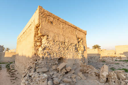 Ruined house still standing in the abandoned village of Al Jazirah Al Hamra at sunset, Emirate of Ras Al Khaimah, United Arab Emiratesの写真素材