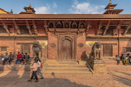 Lalitpur, Patan, Nepal - April  3, 2019: One of the entrance of the Moo Chuka Palace of the Durbar Square of Patan, taken during a partly cloudy afternoonのeditorial素材
