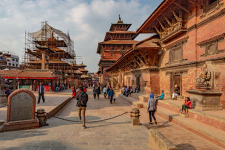 Lalitpur, Patan, Nepal - April 3, 2019: The entrance of the Durbar Square of Patan, taken during a partly cloudy afternoonのeditorial素材