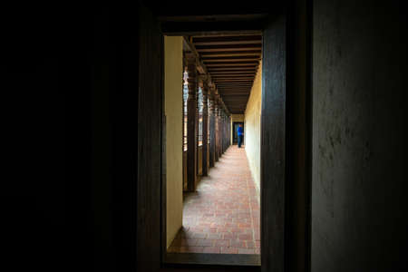 Bhaktapur, Nepal - April 5, 2019: Man about to enter a room of the 55 Window Palace located in the historical center of Bhaktapurのeditorial素材