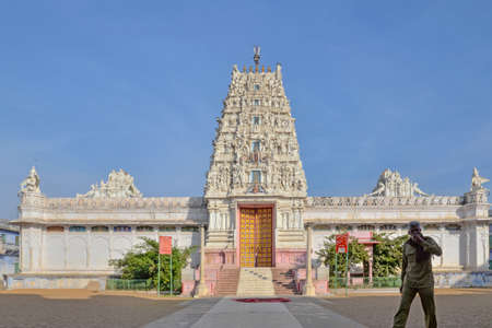 Pushkar, India - December 7, 2015: Temple and a man walking in front of it, taken on a winter sunny afternoon.のeditorial素材