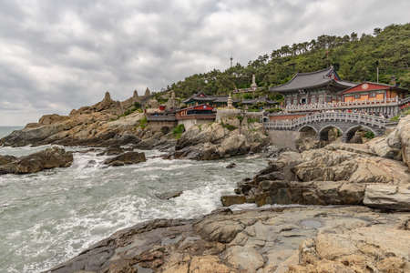 Busan, South Korea - June 9, 2019: Yonggungsa temple seen from the sea on a cloudy summer afternoonのeditorial素材