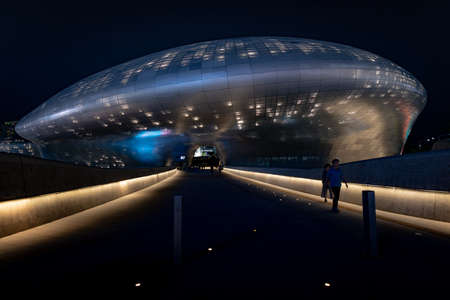 Seoul, South Korea - June 11, 2019: Main entrance of the Dongdaemun design plaza showing architectural lighting and building curves at nightのeditorial素材