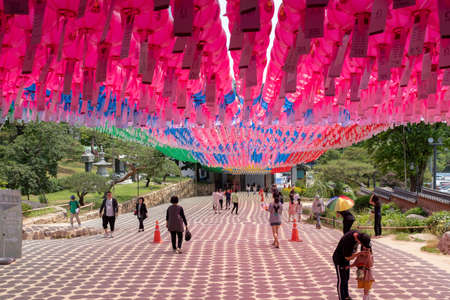 Seoul, South Korea - June 2, 2019: Tourists and visitors under colourful lanterns during day time at the Bongeunsa buddhist templeのeditorial素材