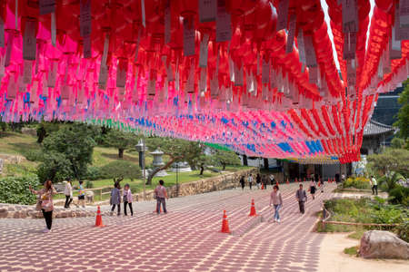 Seoul, South Korea - June 2, 2019: Tourists and visitors under pink and red lanterns during day time at the Bongeunsa buddhist templeのeditorial素材