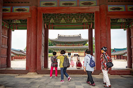 Seoul, South Korea - June 1, 2019: A group of four women are about to enter the Changdeokgung Palace through a gateのeditorial素材