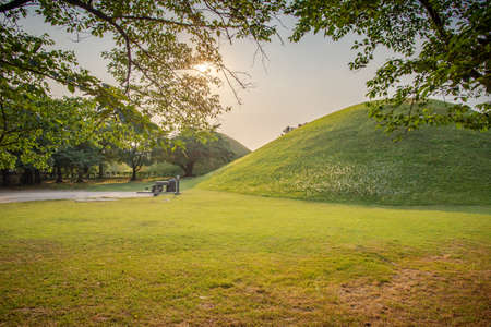 Gyeongju, South Korea - June 5, 2019: View on the most famous Daereungwon Tomb taken at sunsetのeditorial素材