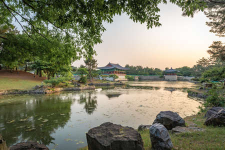 Gyeongju, South Korea - June 5, 2019: Framed view of one pavilion of the Donggung Palace and the Wolji Pond shot at sunsetのeditorial素材