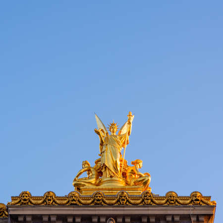 Gold sculpture on top of Paris Opera, taken on a spring morning with perfect blue sky and no peopleのeditorial素材