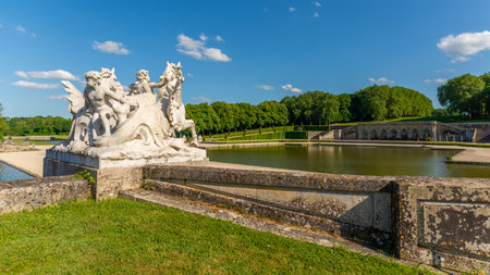 Maincy, France - May 21, 2022: A sculpture representing horses and cherubim in a French classical garden (Vaux-le-Vicomte). Photo taken in an early summer sunny day with no recognizable people.のeditorial素材
