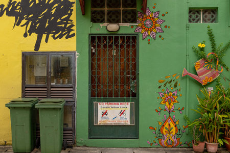 Kampong Glam, Singapore - December 19, 2022: Anonymous artwork of the back streets of the Muslim district of Kampong Glam representing flowers being watered with a water can with no peopleのeditorial素材