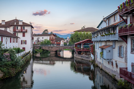 Nive River crossing the town of Saint-Jean-Pied-de-Port in Basque Country, South West France, taken early morning on a sunny summer day with no recognizable people.の写真素材