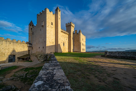The Beynac castle in Perigord, South West France. Taken at golden hour, on a sunny autumn day, with no peopleの写真素材